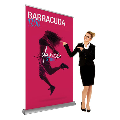 Professional woman presenting Barracuda 1200 banner stand for trade shows and exhibitions