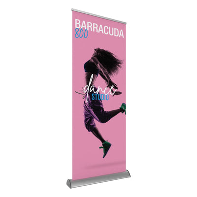 Retractable banner stand displaying dynamic dance studio advertisement for trade shows and exhibitions