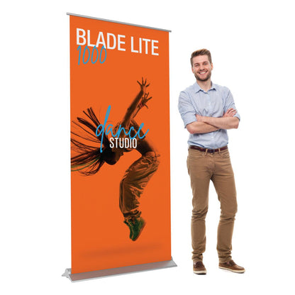 Retractable banner stand for trade shows featuring dynamic dance studio promotion with dancer image and heading