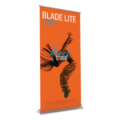Retractable trade show banner stand featuring dynamic dance studio graphic for exhibitions and events