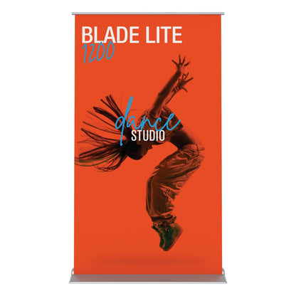 Retractable banner stand for trade shows featuring dynamic dance studio advertisement with jumping dancer