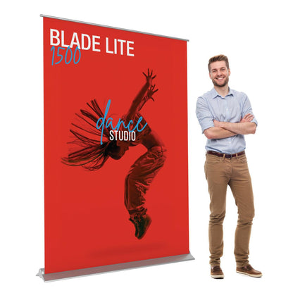 Blade Lite 1500 banner stand with dance studio design, ideal for trade shows and exhibitions, next to smiling man