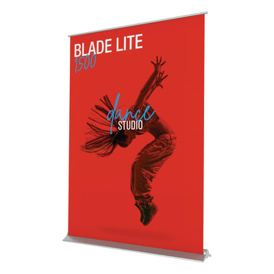 Retractable banner stand displaying dynamic dance studio advertisement for trade shows and exhibitions