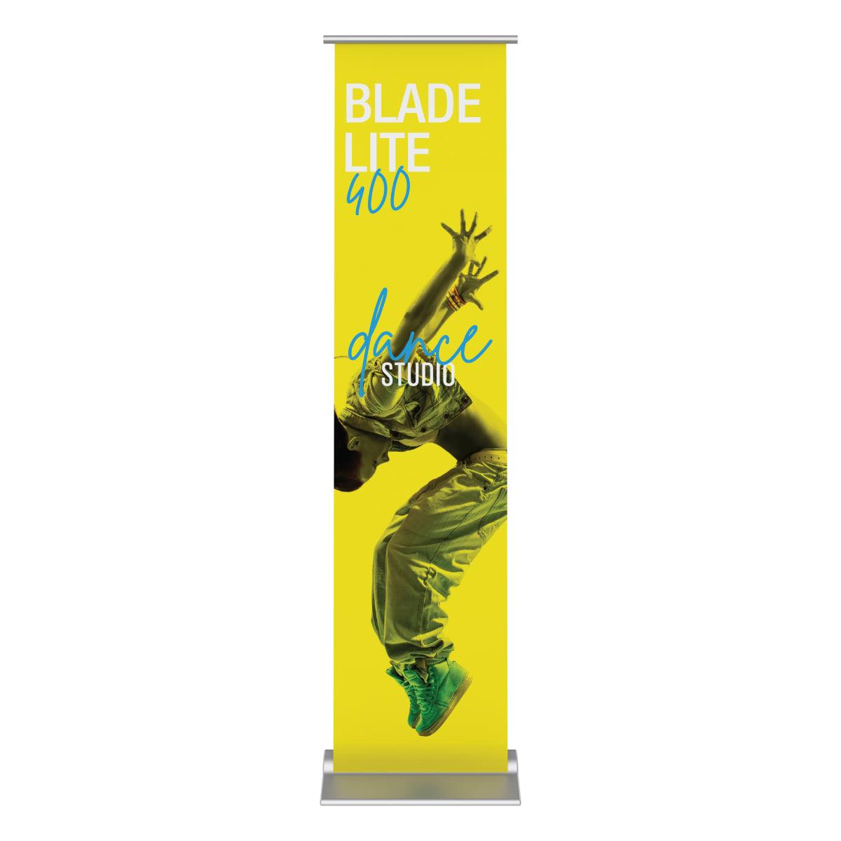 Tall retractable banner stand displaying dynamic dance studio advertisement for trade shows and exhibitions