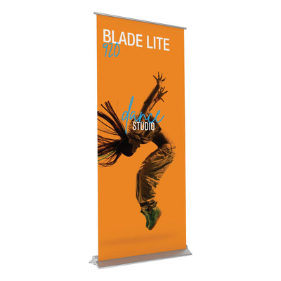 Retractable banner stand displaying dynamic dance studio advertisement for trade shows and exhibitions