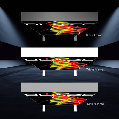 Three illuminated trade show ceiling light box displays with black, white, and silver frames showcasing vibrant event graphics