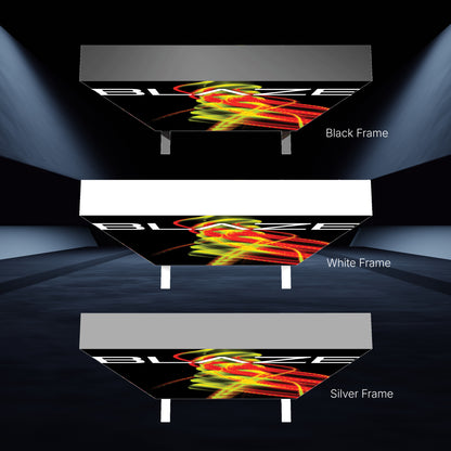 Three illuminated trade show ceiling light box displays with black, white, and silver frames showcasing vibrant event graphics