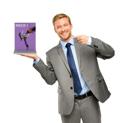 Businessman in suit holding and pointing to a tabletop banner stand for trade shows and exhibitions