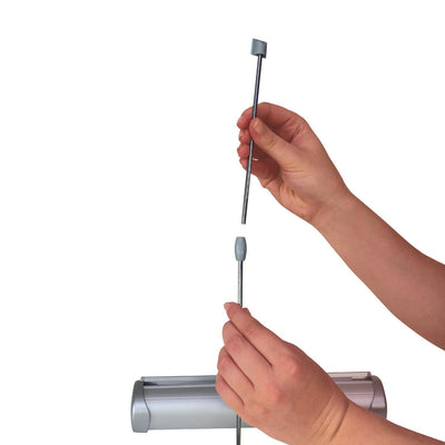 Hands assembling a tabletop banner stand frame for trade shows and exhibitions