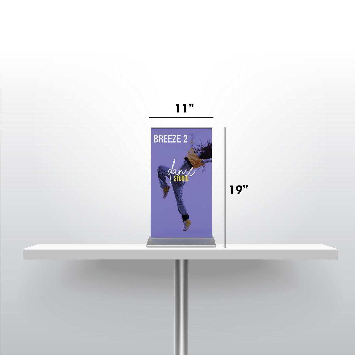 Compact tabletop banner stand measuring 11 by 19 inches for trade shows and exhibitions