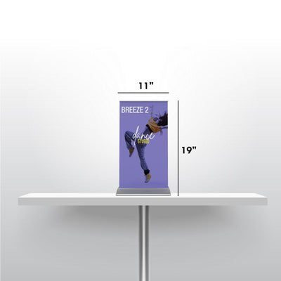 Compact tabletop banner stand measuring 11 by 19 inches for trade shows and exhibitions