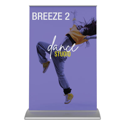 Tabletop banner stand for trade shows featuring dynamic dance studio promotion with energetic dancer image
