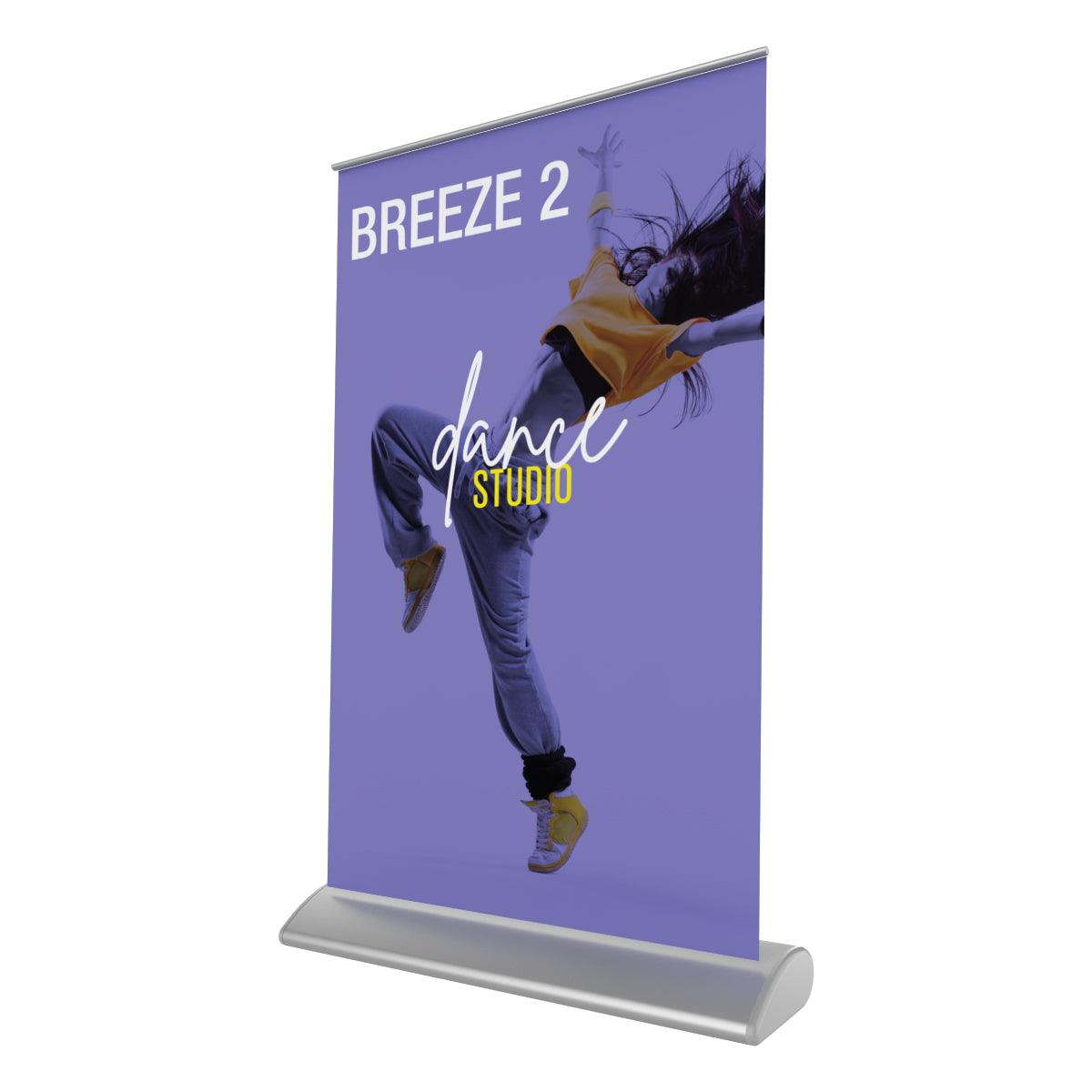 Retractable tabletop banner stand displaying dance studio advertisement for trade shows and events
