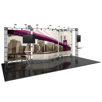 Trade show display with modular truss system, large graphic panel, dual monitor mounts, and speaker shelves