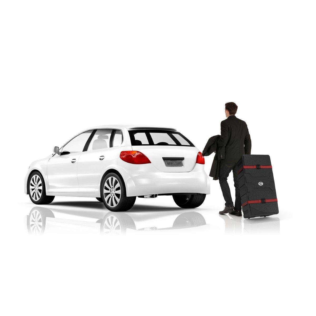 Businessman pulling durable rolling case for trade show or event setup next to parked car