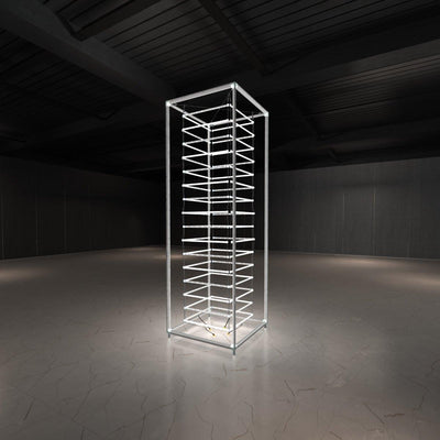 Tall illuminated modular tower structure for trade shows and exhibitions in an empty event space