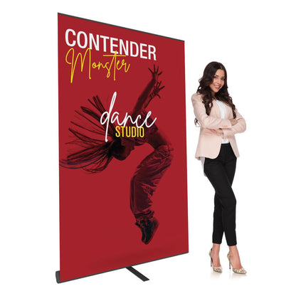 Trade show banner stand featuring Contender Monster dance studio graphic with professional woman posing