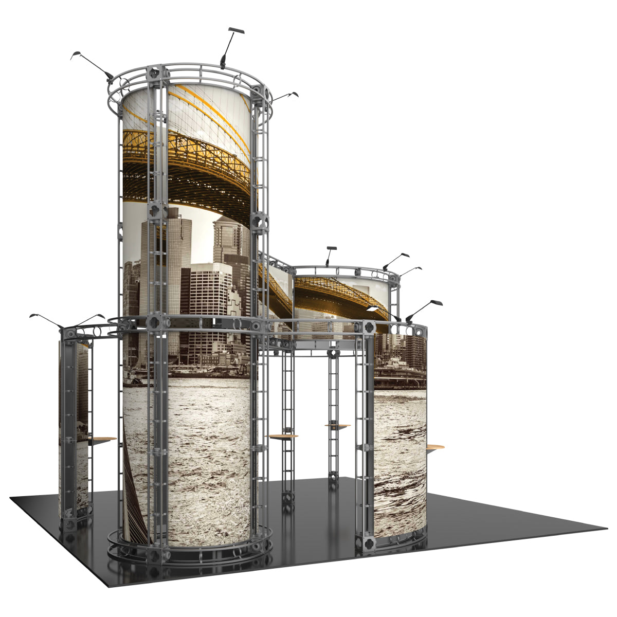 Trade show display with tall cylindrical truss structures featuring cityscape graphics for exhibitions