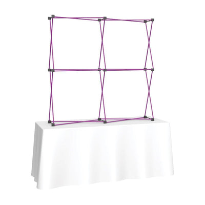 6ft collapsible fabric tabletop display frame on white covered trade show table for exhibitions