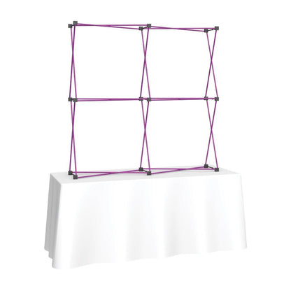 6ft collapsible fabric tabletop display frame on white covered trade show table for exhibitions