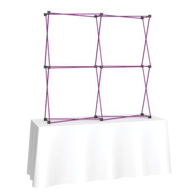 Frame structure for tabletop trade show display on draped table, ideal for exhibitions and events