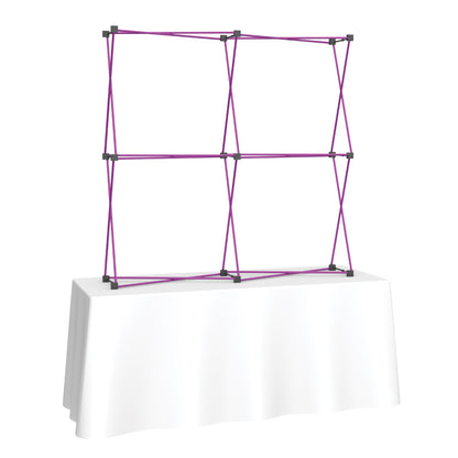 Frame structure for tabletop trade show display on draped table, ideal for exhibitions and events