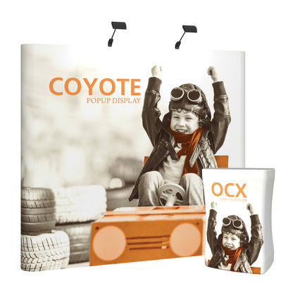 Trade show popup display featuring excited child in aviator gear with vintage car and OCX case to counter