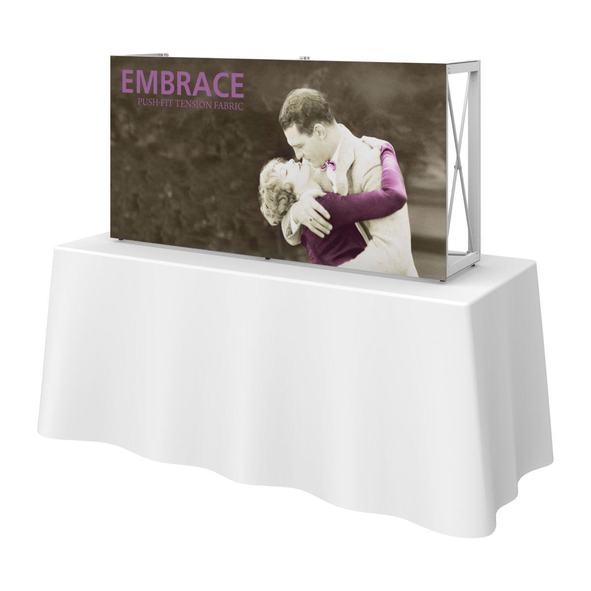 Tabletop display with fabric graphic showing embracing couple, ideal for trade shows and special events