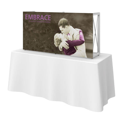 Tabletop display with fabric graphic showing embracing couple, ideal for trade shows and special events