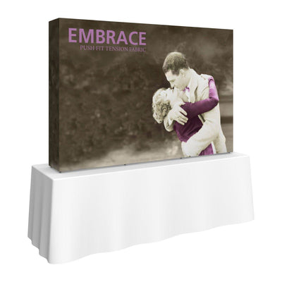 7.5ft tabletop fabric display with vintage couple embrace image and Embrace push-fit logo for trade shows