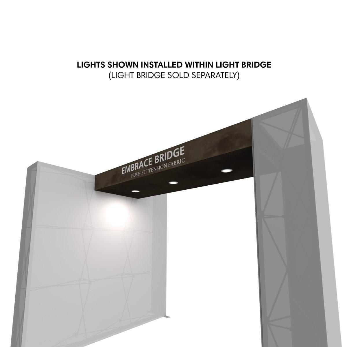 Trade show light kit installed within Embrace Bridge tension fabric display for exhibitions and events