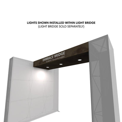 Trade show light kit installed within Embrace Bridge tension fabric display for exhibitions and events