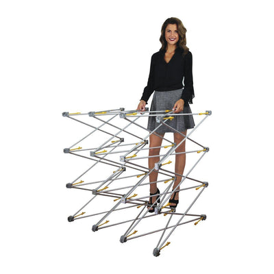 Woman setting up expandable frame structure for trade shows, exhibitions, and special events display