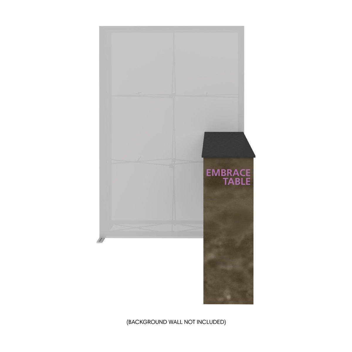 Compact trade show Embrace Table with angled top beside large display frame for exhibitions and events