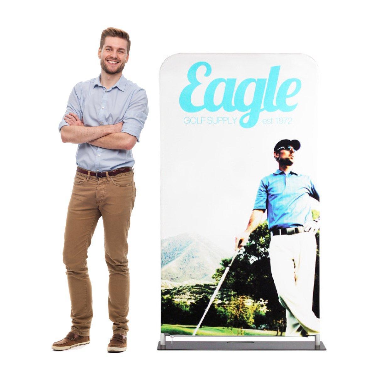 Man standing next to fabric display with golf-themed graphics for trade shows and exhibitions