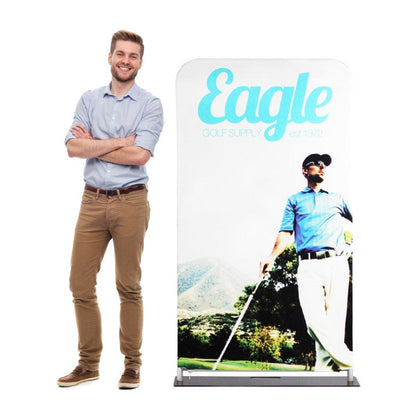 Man standing next to fabric display with golf-themed graphics for trade shows and exhibitions