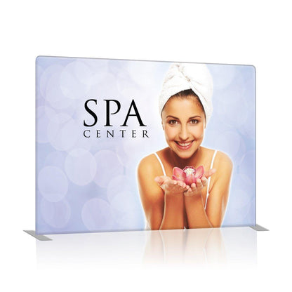 Trade show display featuring spa center advertisement with a smiling woman holding a flower