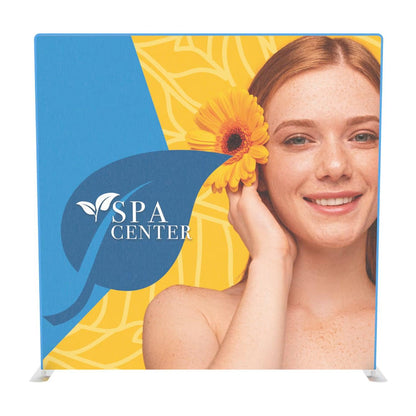 Trade show display featuring a smiling woman with a flower and spa center logo, ideal for exhibitions