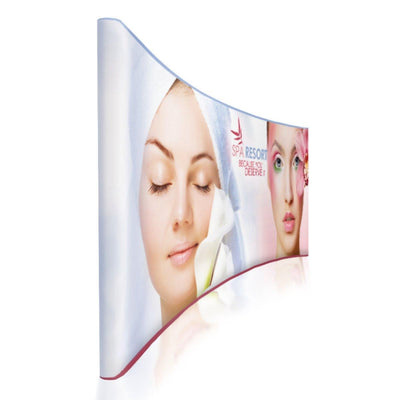 Curved 20ft trade show display featuring spa and beauty resort graphics for exhibitions