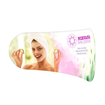 Curved trade show display featuring spa promotion with smiling woman, face mask, and spa center branding