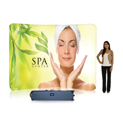 Curved trade show display featuring spa center branding with woman and green leaves for exhibitions