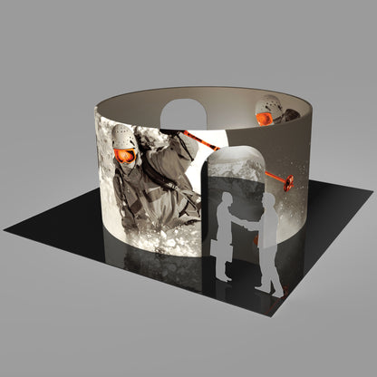 Circular trade show booth with large ski sport graphics and entrance cutouts for exhibitions and events