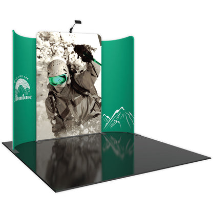 Trade show display with large skier graphic and curved side panels featuring mountain adventure branding