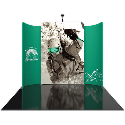 Curved trade show display with adventure-themed graphics featuring skier and mountain imagery for exhibitions and special events