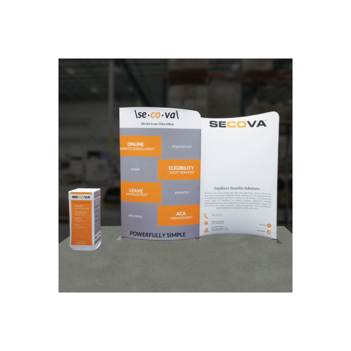 Trade show display featuring SECOYA branded pop-up banner and promotional counter for employee benefits solutions