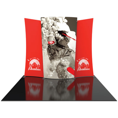 Curved trade show display with skier graphic and adventure-themed side panels for exhibitions
