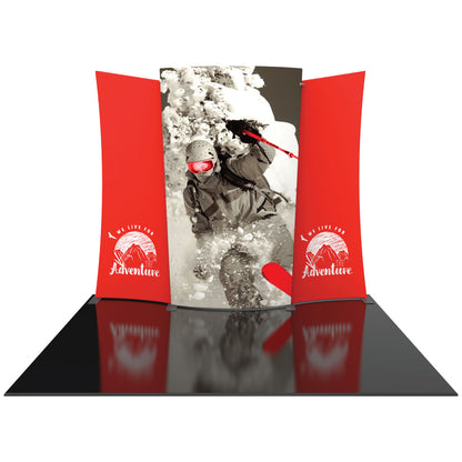 Curved trade show display with skier graphic and adventure-themed side panels for exhibitions