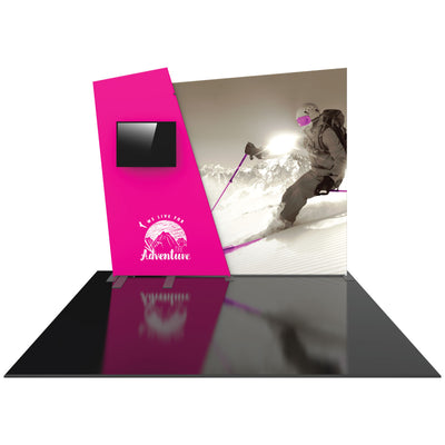 Trade show display with large graphic of skier on snow-covered mountain and built-in monitor