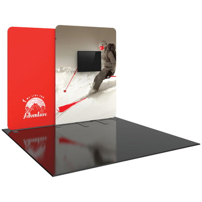 Trade show fabric display with adventure-themed graphics and integrated monitor for exhibitions