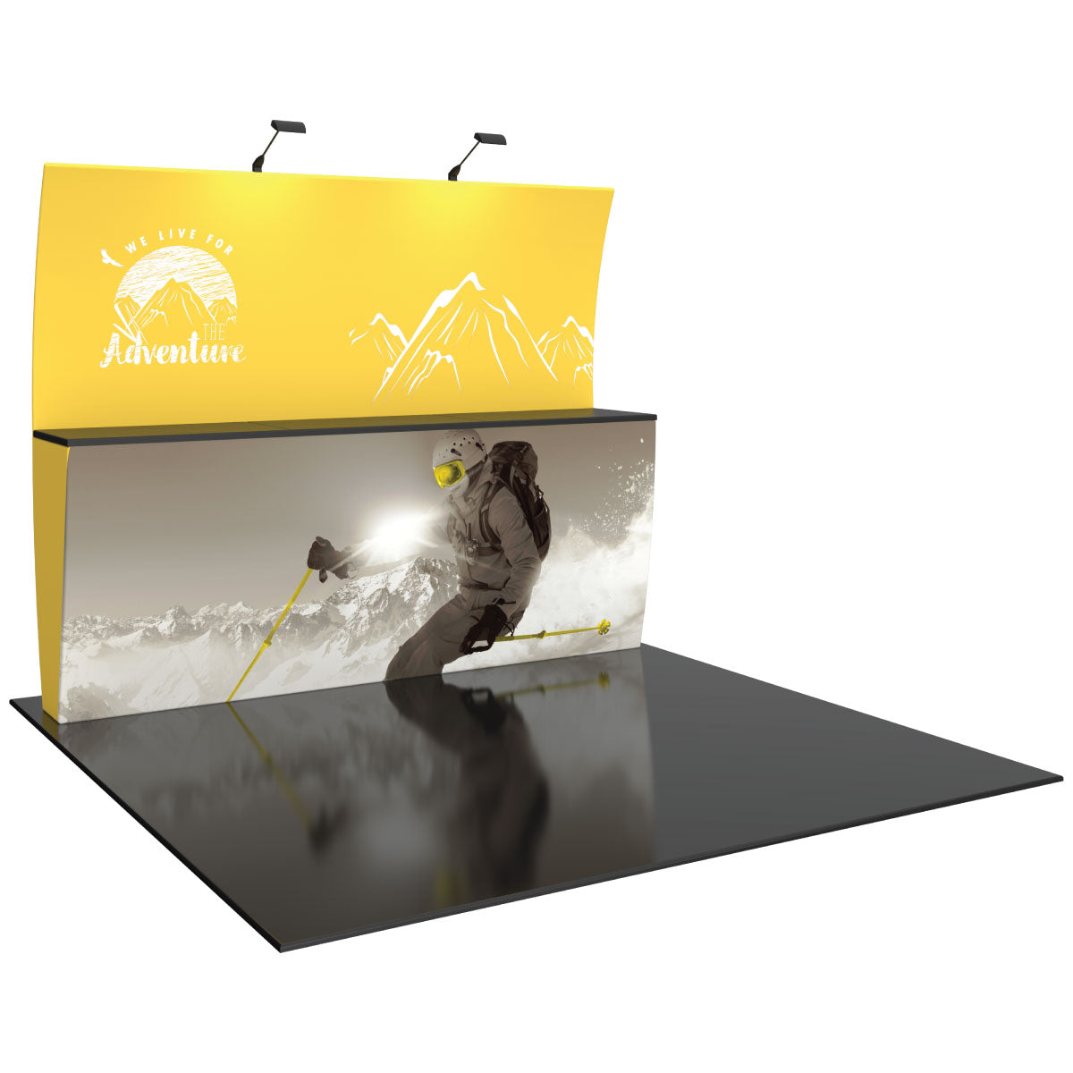 Trade show display with curved backdrop and counter featuring adventurous skiing graphics for exhibitions and events